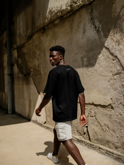 Man walking against a textured wall